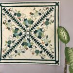 Sheer Applique Vintage Tablecloth Transformed into a Beautiful Quilted Wall Hanging (must love green!)